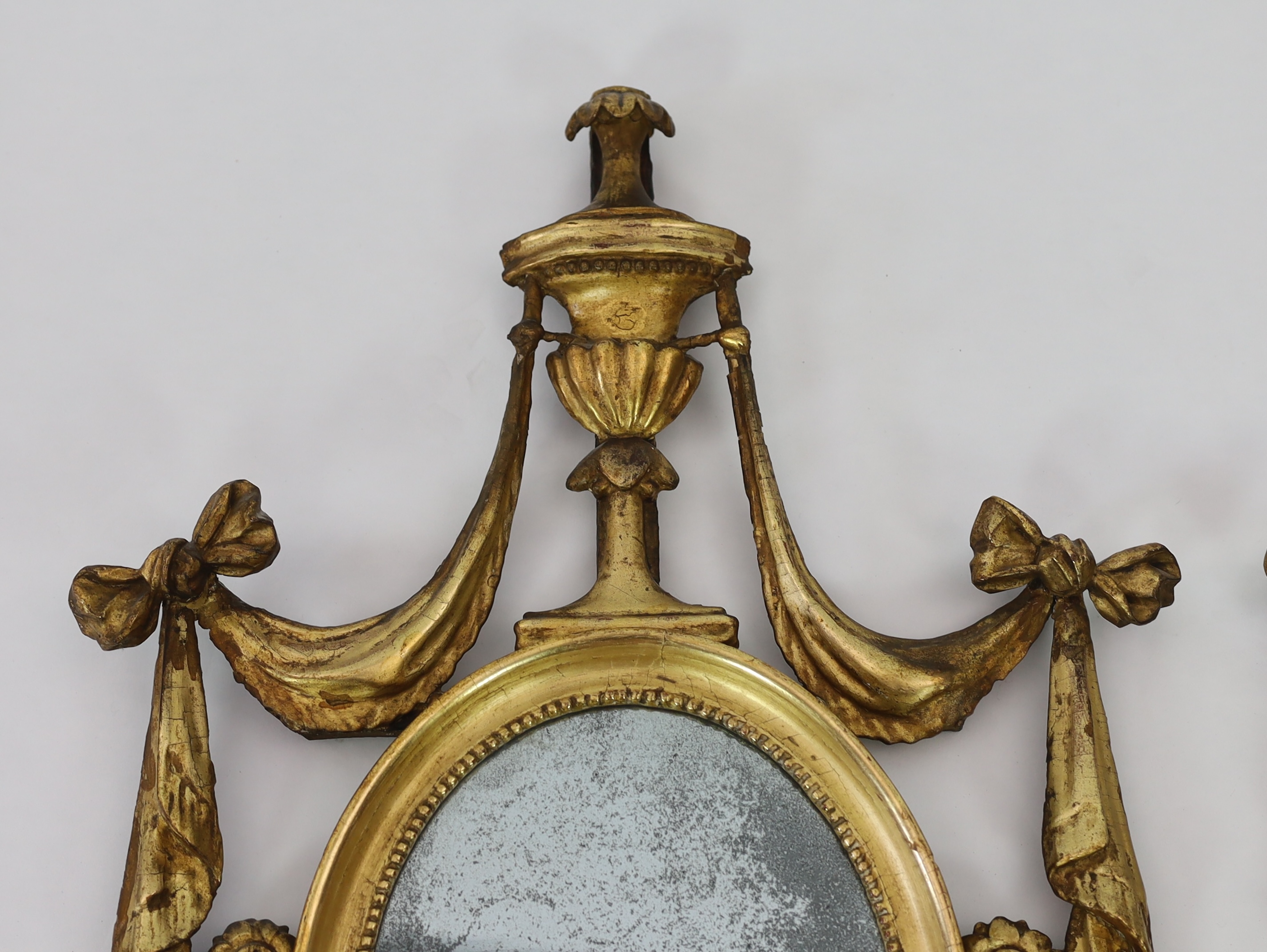 A pair of late 18th century Adam period giltwood wall mirrors